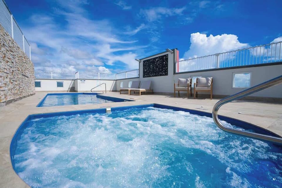 The shared pool and rooftop area is the perfect place to relax under the sun.