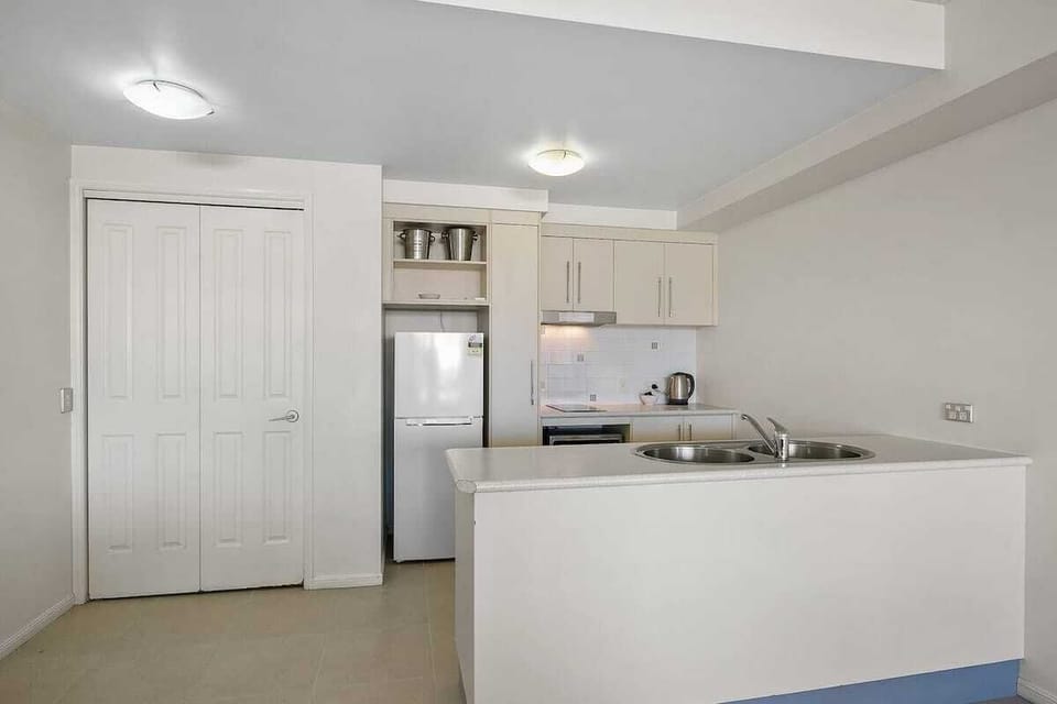 The self-contained kitchen is equipped with the appliances and utensils you'll need to cook a meal at home. It includes a fridge, stove, microwave and dishwasher.