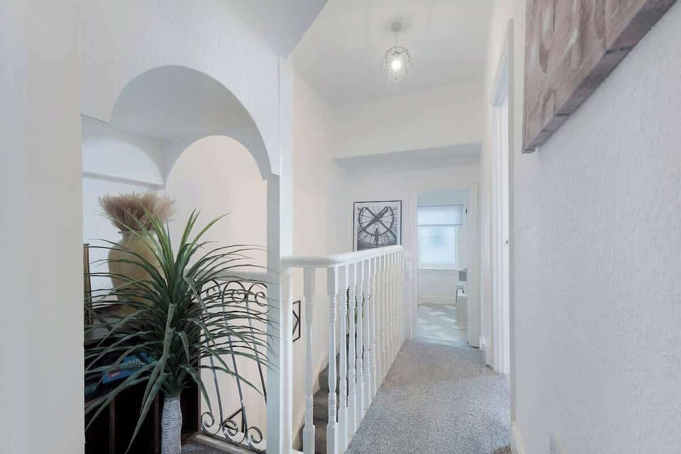 The half bathroom benefits from an overhead shower combination, toilet and a sink. 
