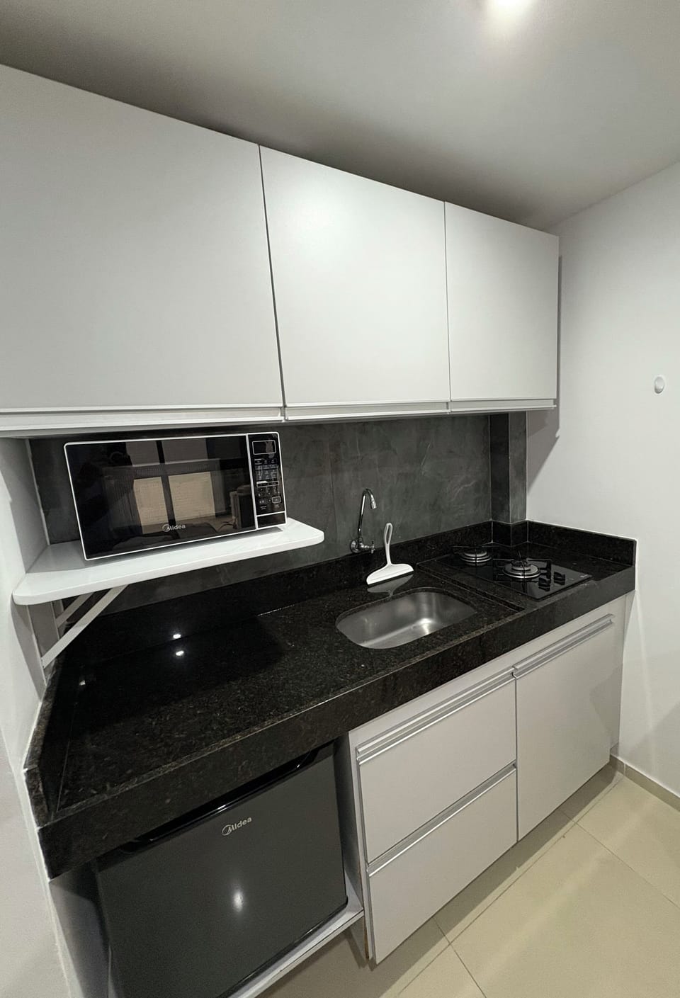 Apartment | Private kitchen | Mini-fridge, microwave, stovetop, cookware/dishes/utensils