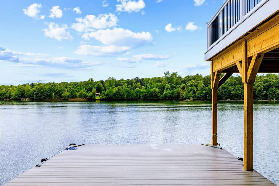 Sun Deck - The open dock platform reaches out over the water, nothing between you and the far tree line.