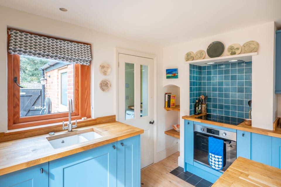 Ground Floor: Kitchen with access to downstairs shower room