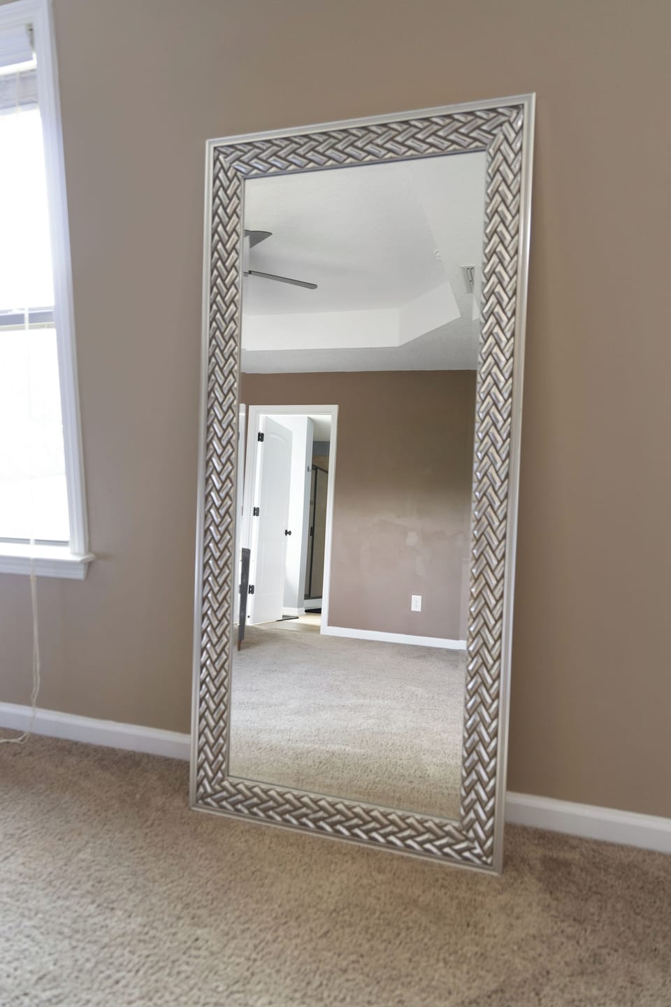 Large standing mirror in the bedroom