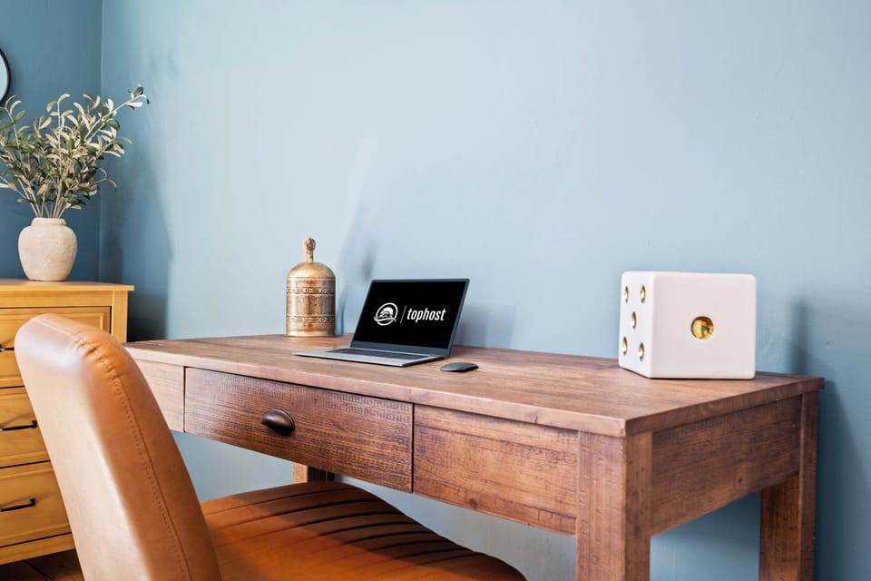 Calm blue office with wooden accents and modern decor.