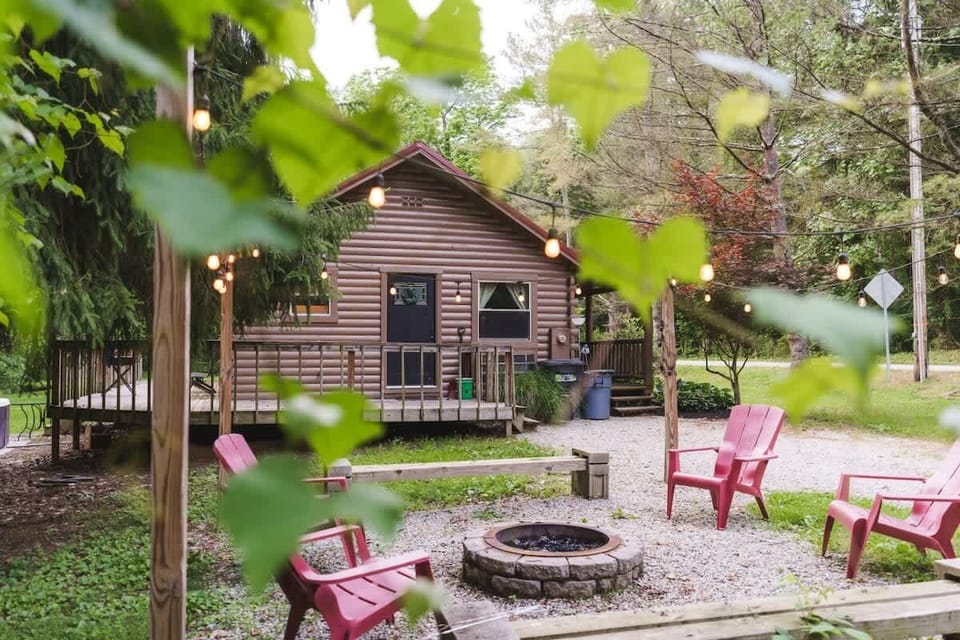Gather around the backyard firepit w/ Adirondack chairs just steps from the cabin deck