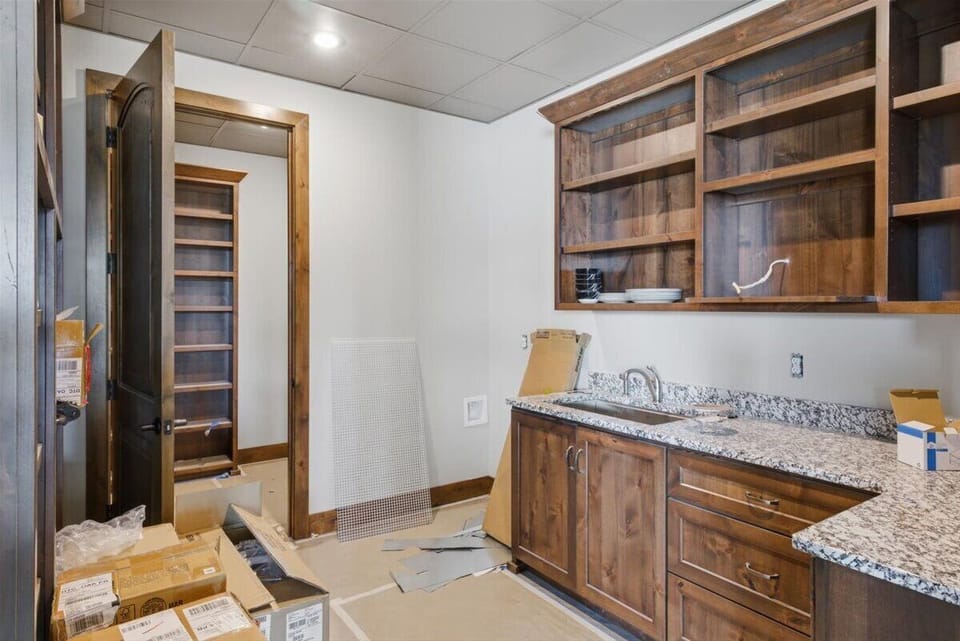 Main level kitchen butler's pantry. Will also feature a full size freezer.