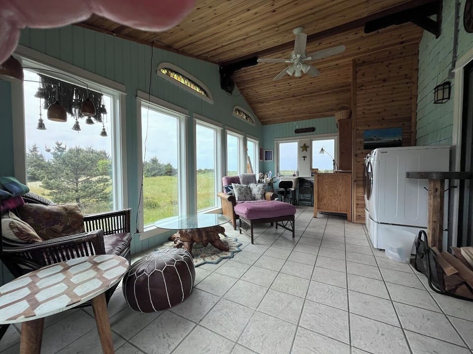 Sun/Mud/Laundry room with art supplies and toys.  Space heater/vent/ceiling fan.
