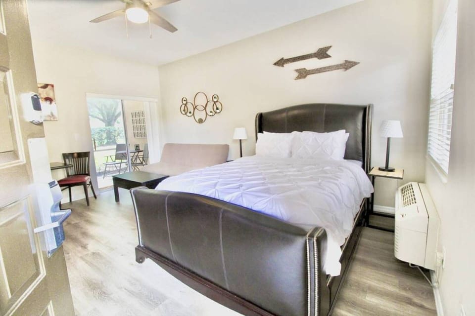 The spacious studio room has a Queen size bed, futon couch, dining area and outdoor screened in patio with seating.