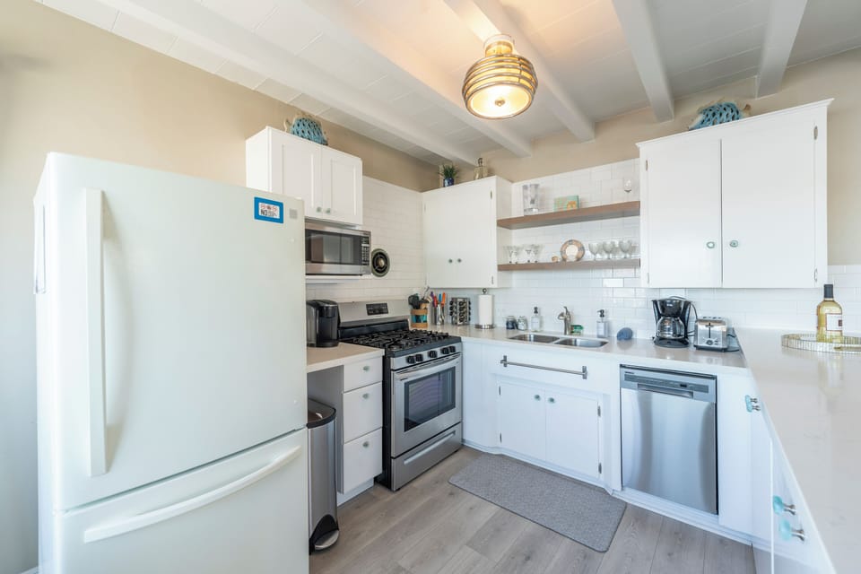 Charming kitchen with vintage touches and modern appliances. (Unit A)