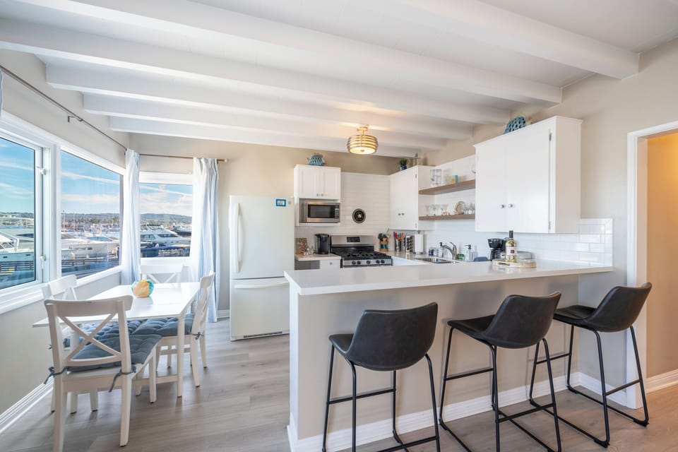Open-concept dining and kitchen area for entertaining. (Unit A)