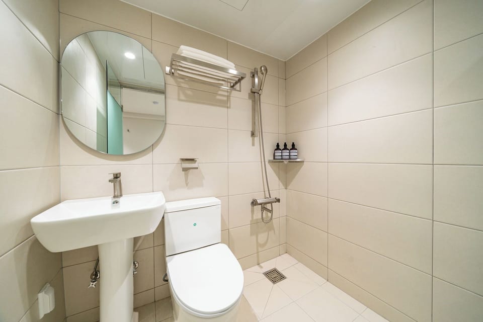 Shower, free toiletries, hair dryer, slippers