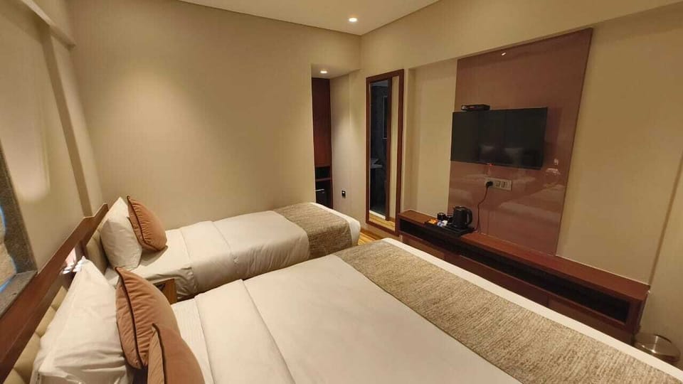 Premium Triple Room, City View | Desk, laptop workspace, free WiFi