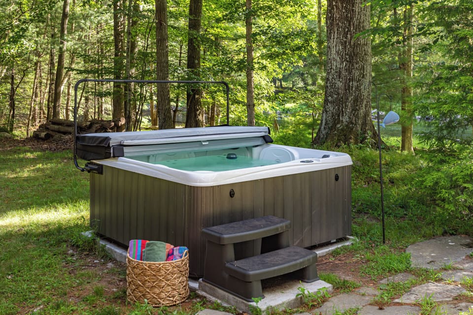 Relax and unwind in the hot tub tucked away in the private backyard, the perfect spot to melt your cares away.