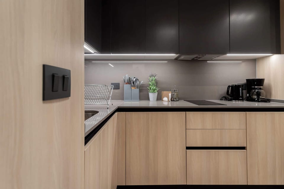 Sleek and modern kitchen with essential appliances, perfect for culinary enthusiasts.