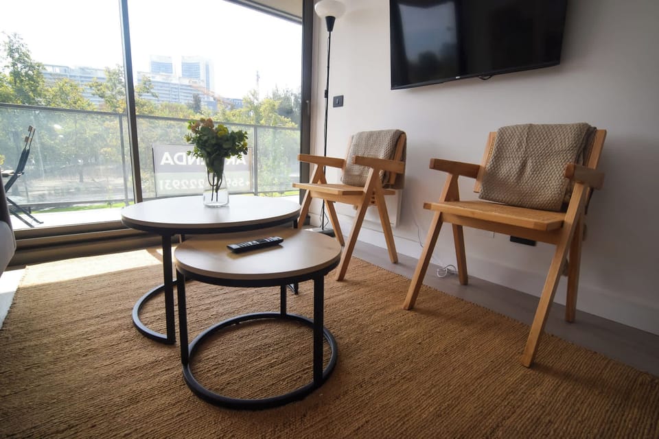 Relax in this cozy living area with modern furnishings and a bright, airy atmosphere, perfect for unwinding after a day of exploring.