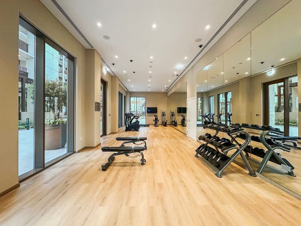 Gym Area: Elevate your fitness routine with modern equipment and natural light streaming in!