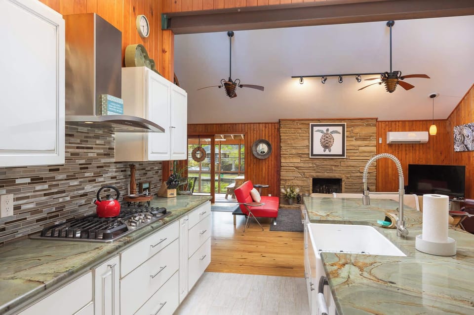 Fully Equipped Kitchen with Refrigerator, Stove, Oven, Microwave,Dishwasher,Nespresso Tea Kettle, Generous Counter Space, Center Island, and Bar Seating, Perfect for Cooking and Socializing Together
