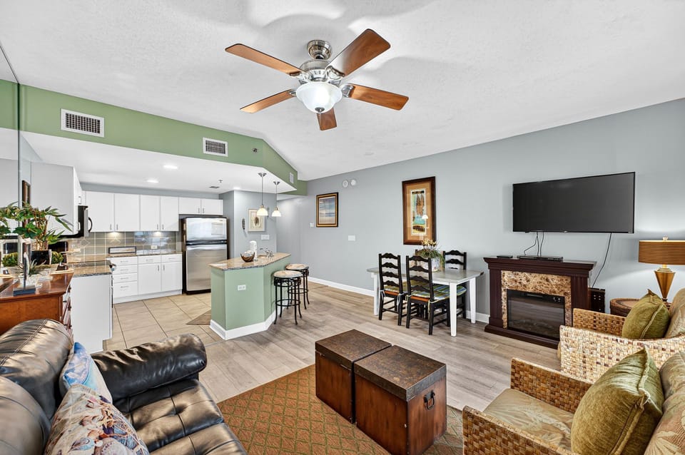 Open-concept living area with modern kitchen and dining space