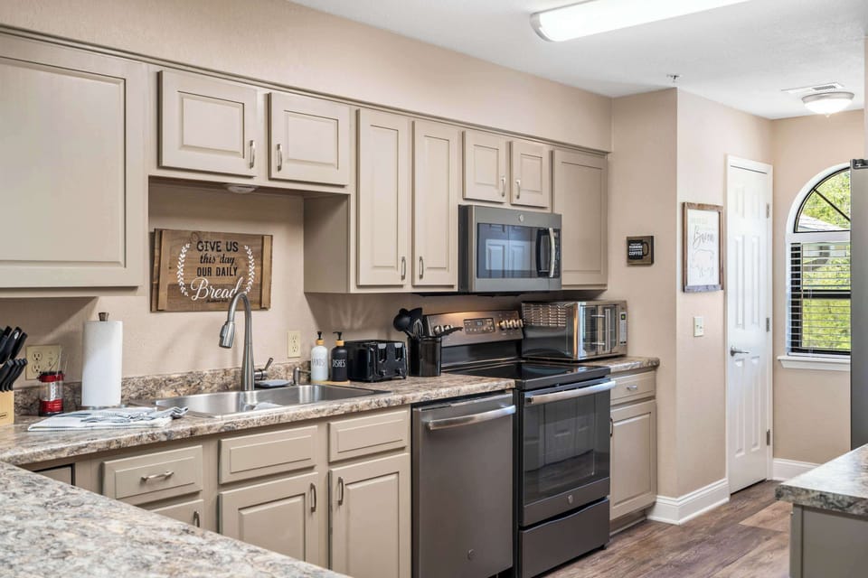 The inviting kitchen offers ample space & every home comfort