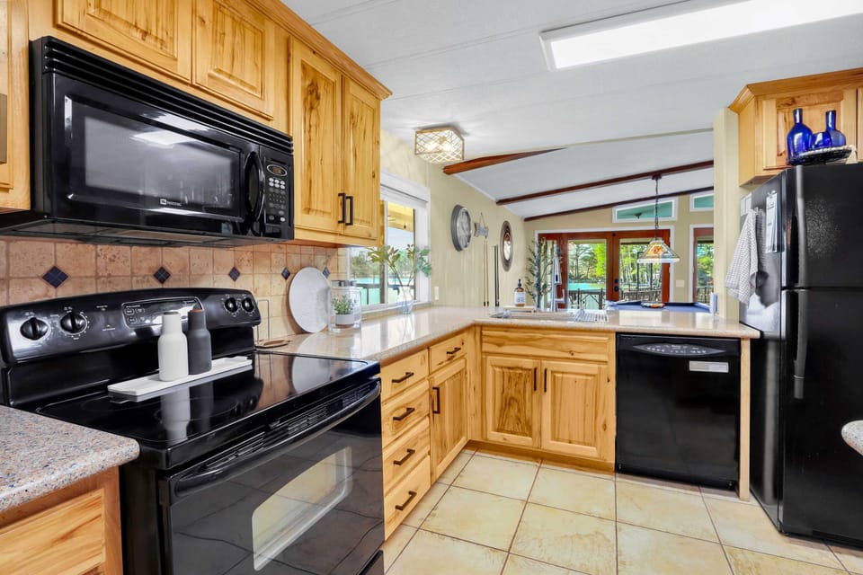 The inviting kitchen offers ample space & every home comfort