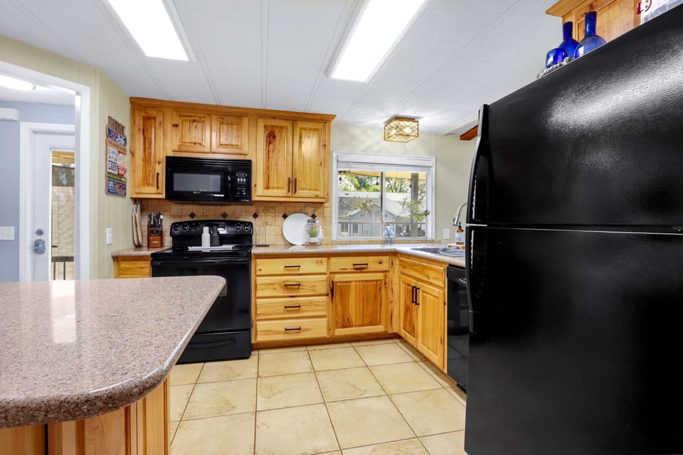 The inviting kitchen offers ample space & every home comfort