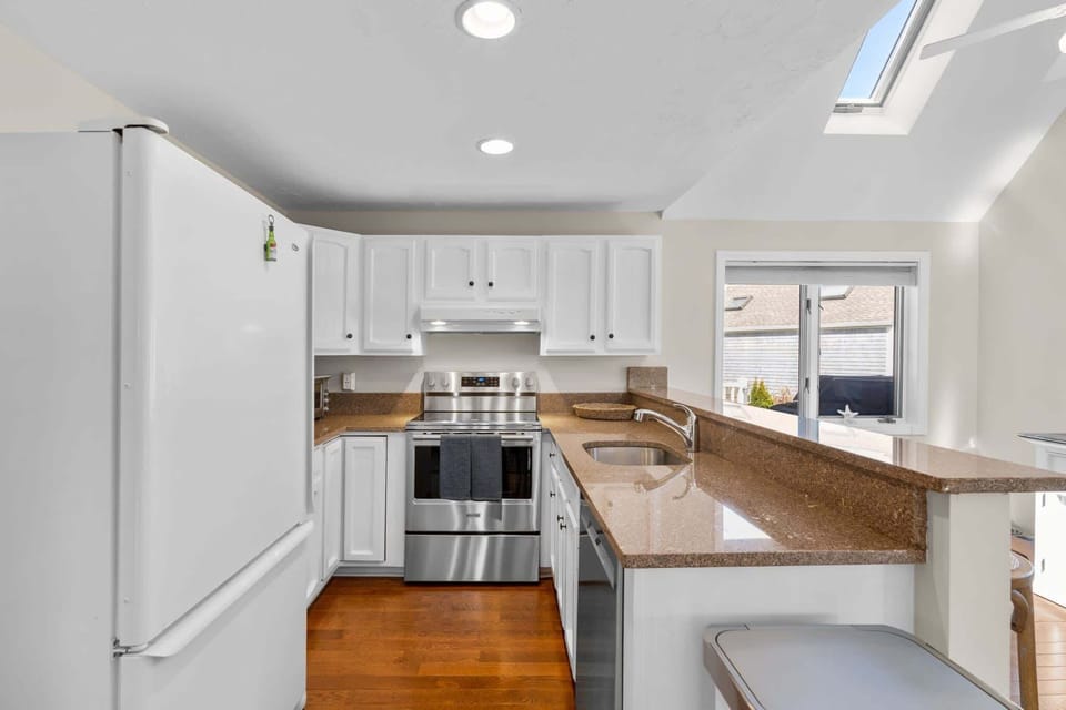 The open, airy kitchen offers ample space & every home comfort