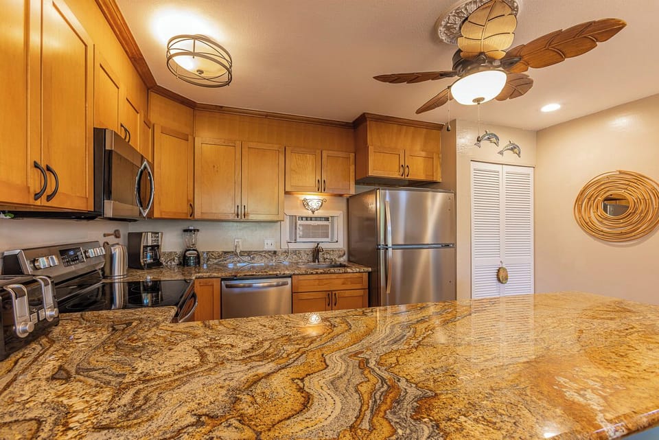 Spacious kitchen with a large countertop, perfect for cooking and entertaining.