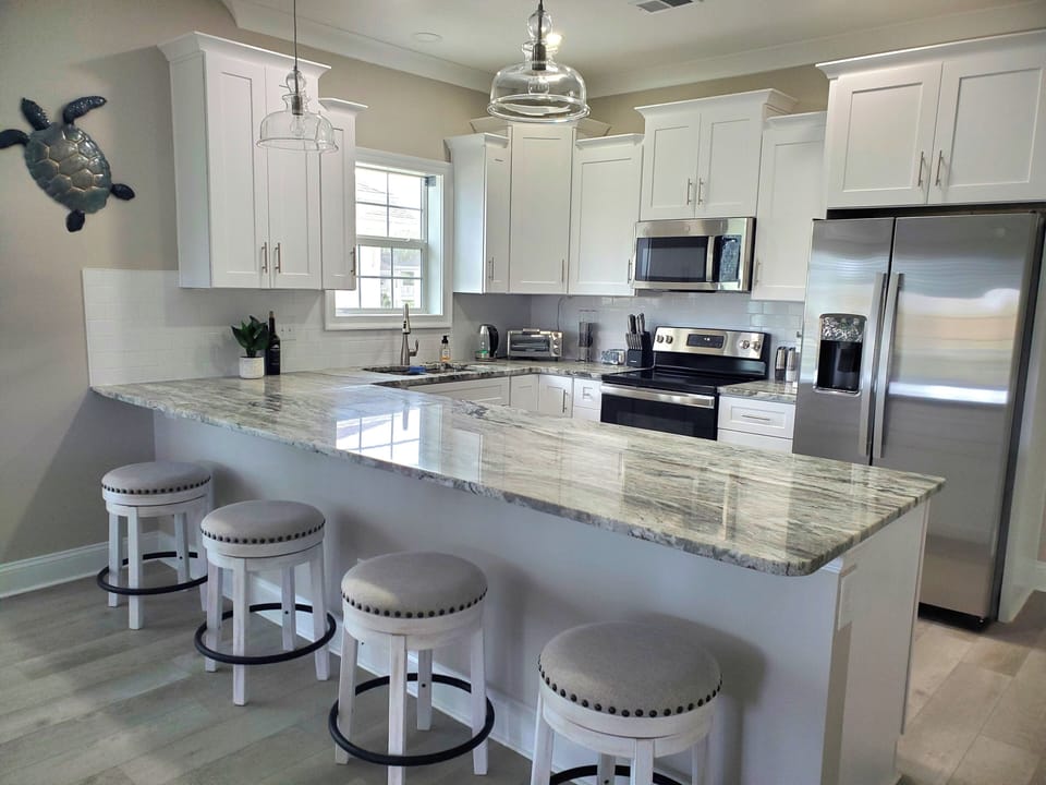 Kitchen With Granite and Island Seating for 4