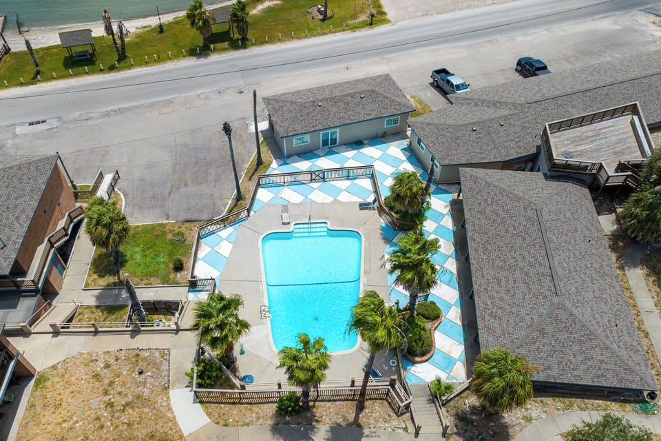 Relax in the pool or enjoy the beach across your  room.