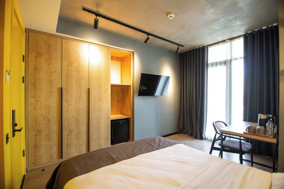 Standard Double Room, Balcony, City View | Blackout drapes, soundproofing, iron/ironing board, free WiFi