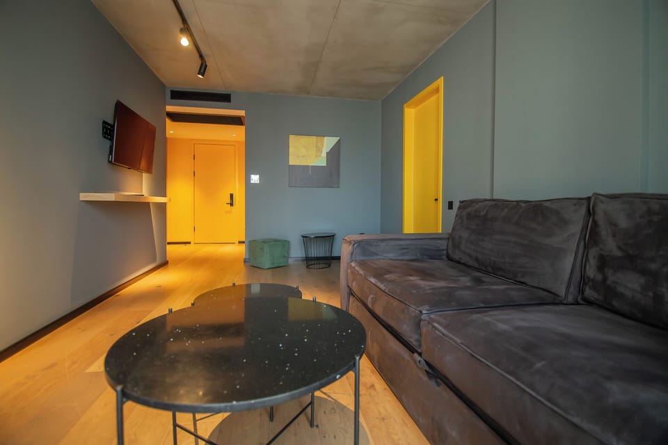 Deluxe Double Room, Balcony | Living area | TV