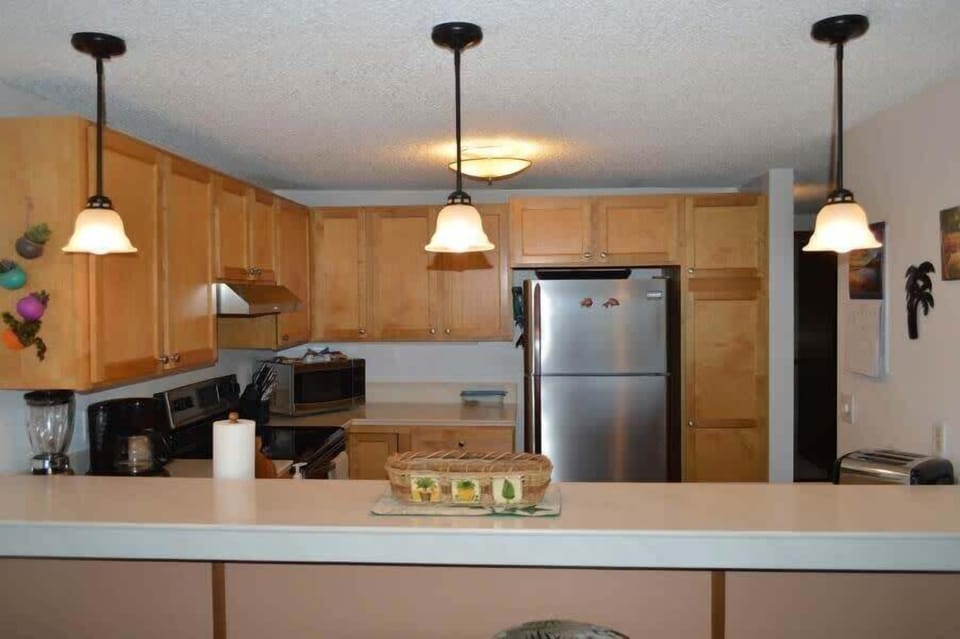 Cook up your favorites in a bright and well equipped kitchen with stainless steel appliances and island charm.