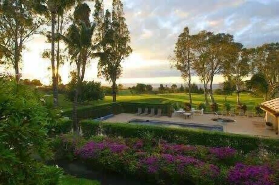 Unwind in the evening with a glass of wine while watching the golden sunset over the manicured grounds.