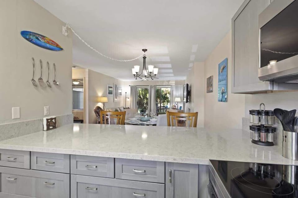 Spacious kitchen with extra counter space and a clear view into the dining and living areas for easy hosting.