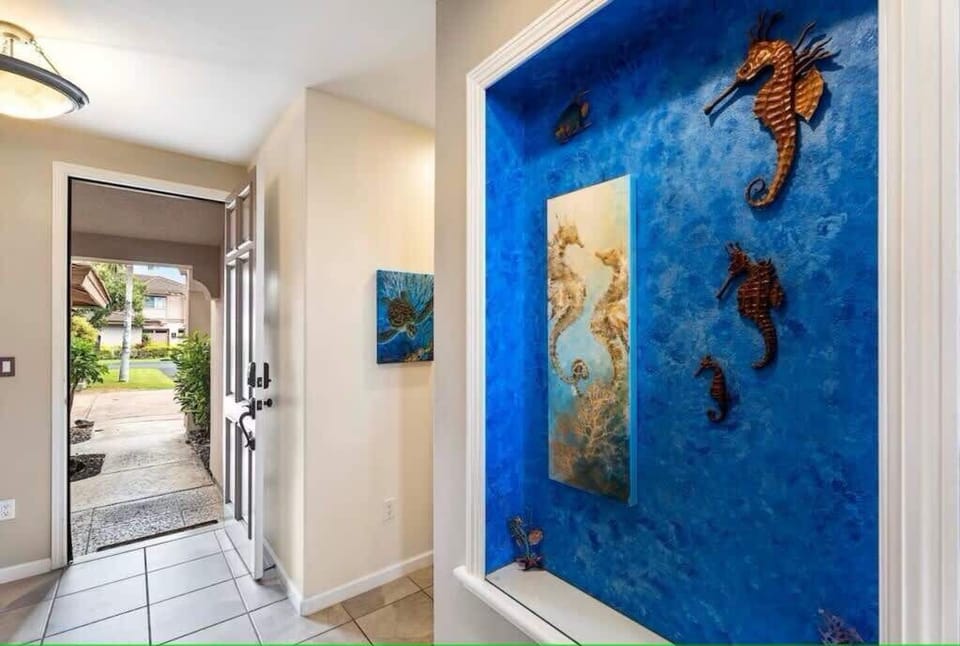 Welcoming entryway featuring a vibrant ocean themed mural, ideal for ocean lovers and art enthusiasts.