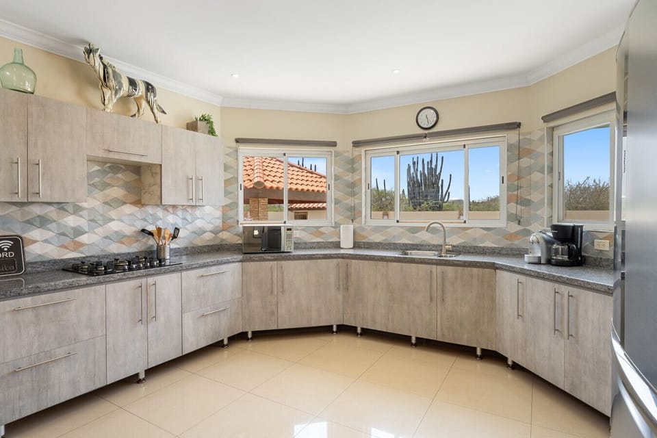 Fully equipped kitchen with appliances Cook like a chef in the spacious kitchen, equipped with modern appliances, cookware, and plenty of counter space. It’s perfect for preparing everything from quick breakfasts to island-inspired dinners.