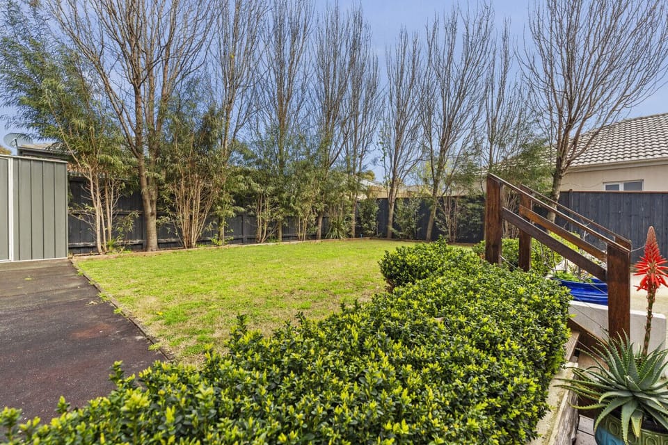Spacious private backyard with lawn—great for kids and outdoor activities