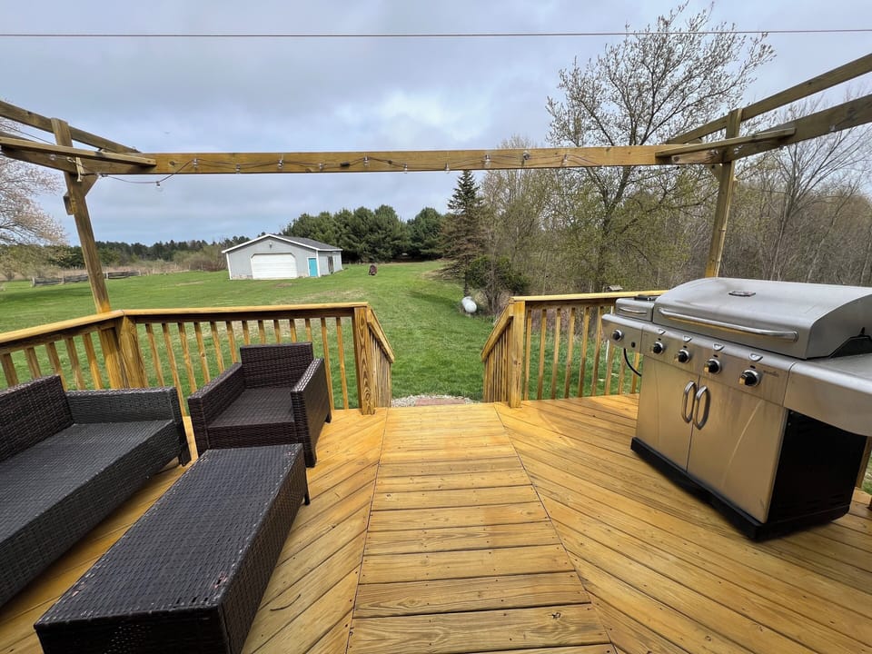 Back deck with seating and BBQ.