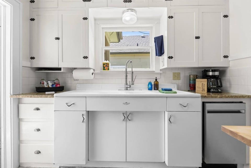 Historic charm and modern comforts await in the fully-equipped eat-in kitchen