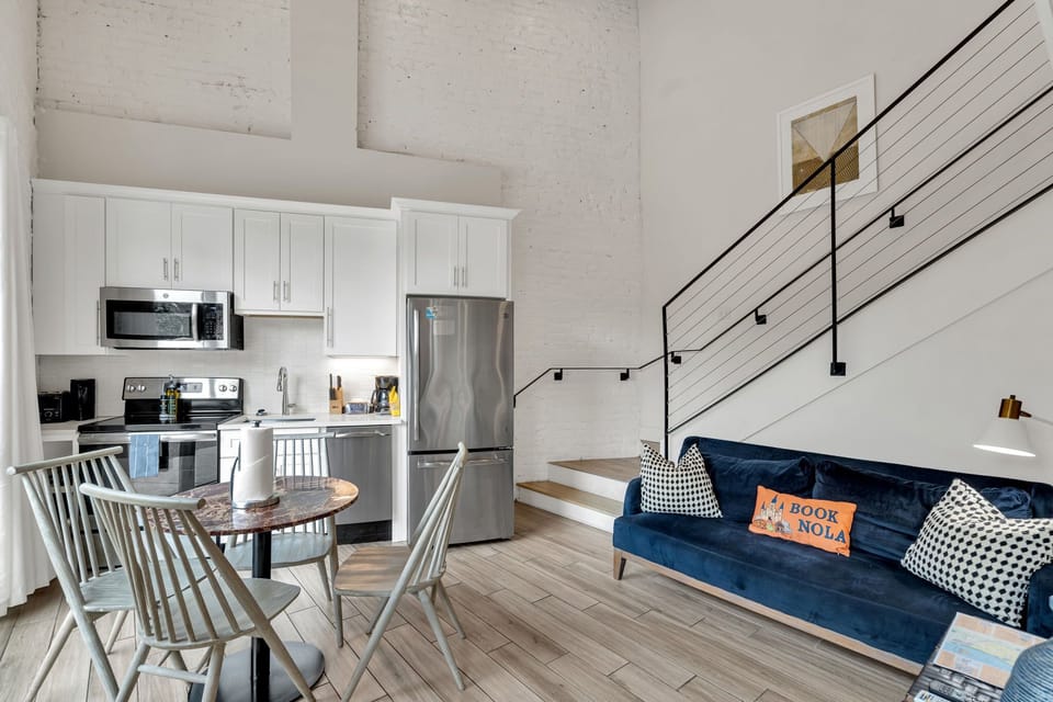 Modern kitchen meets cozy living—cook, dine, and relax in style during your New Orleans stay.