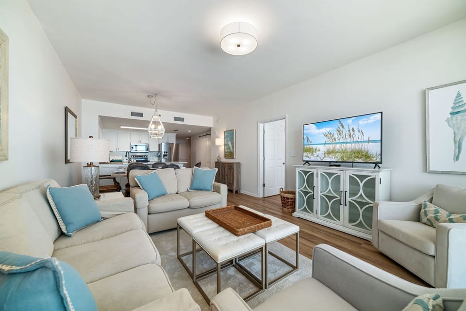 The combination of natural materials, subtle coastal accents, and abundant natural light creates a warm and welcoming ambiance.
