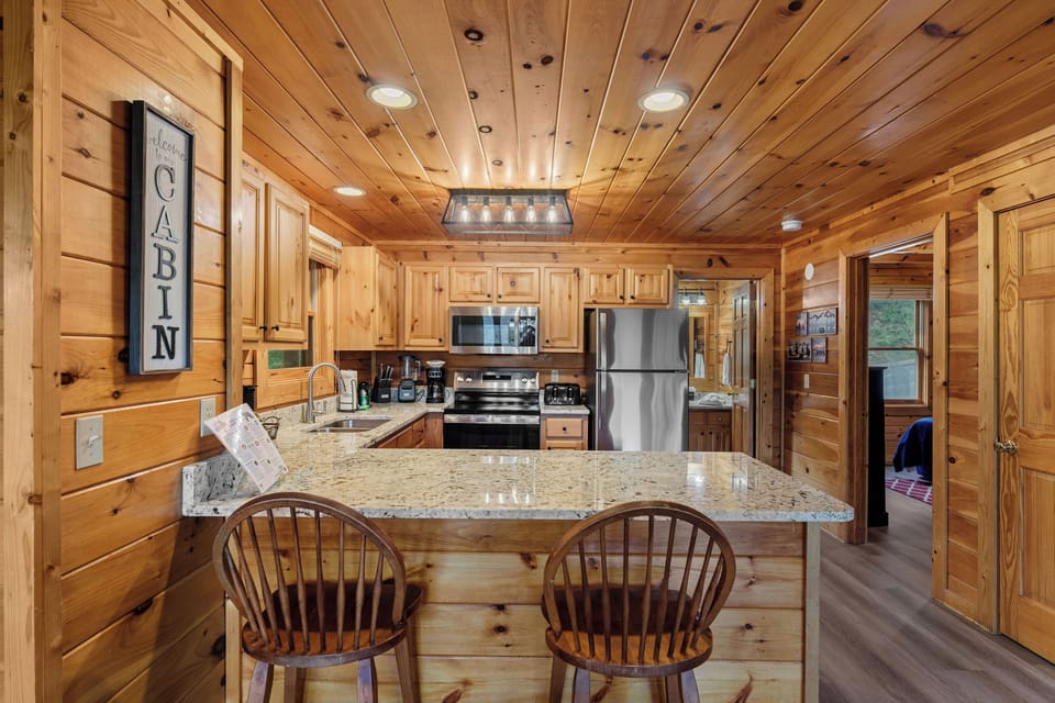 Kitchen with counter seating for casual dining & socializing.