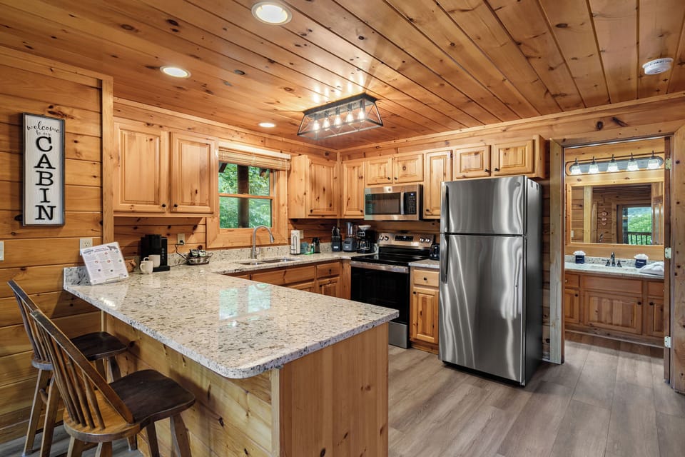 Fully equipped kitchen with coffee maker and Keurig.