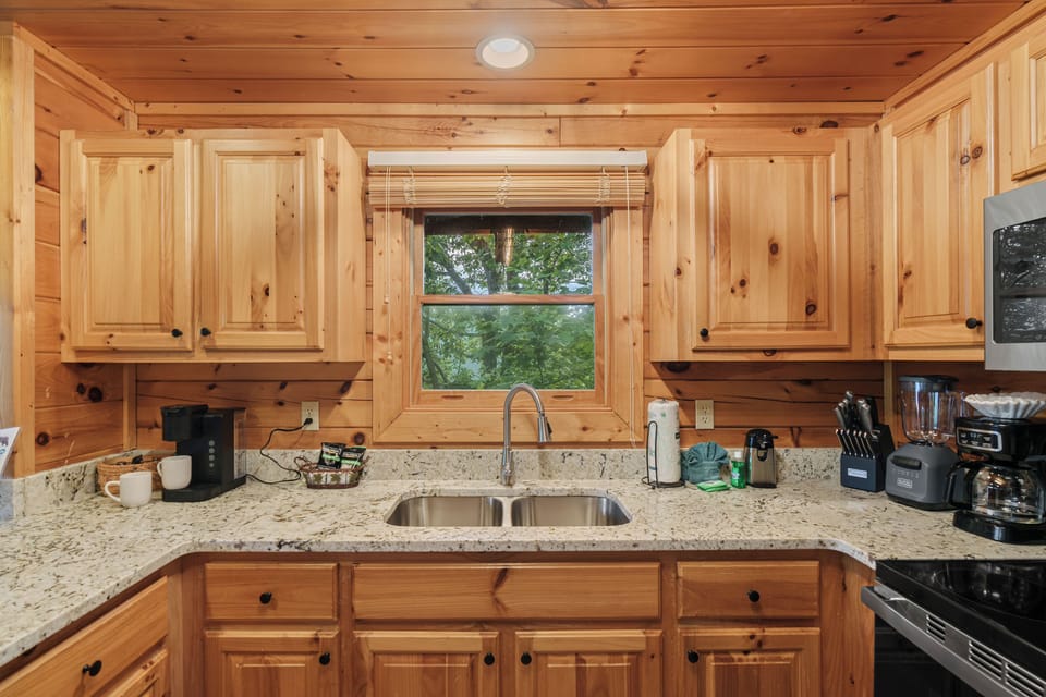 Fully equipped kitchen with coffee maker and Keurig.