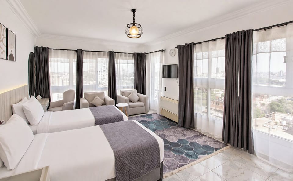 Luxury Double or Twin Room, City View | In-room safe, desk, laptop workspace, blackout drapes