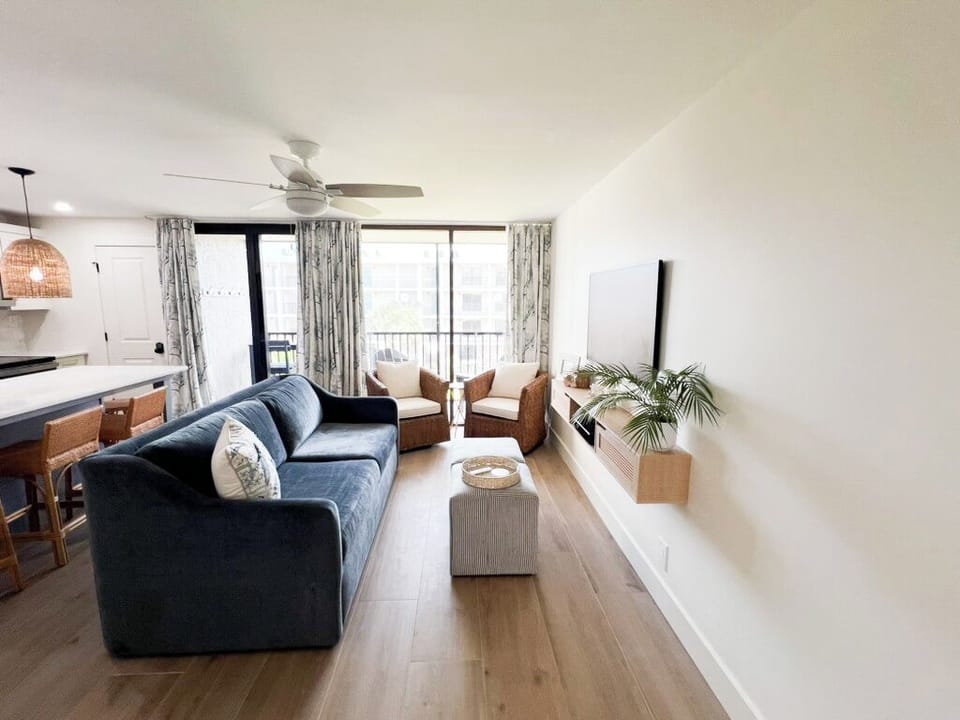 A comfortable couch features a queen-sized sofa bed to accommodate 4 guests