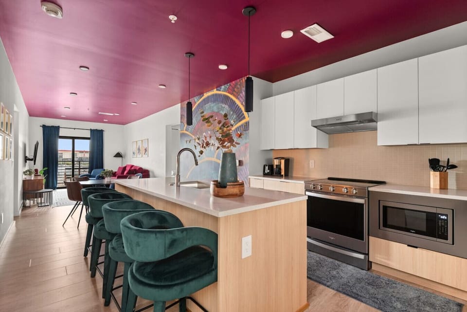 The Rayleigh Kitchen - Sleek and functional, this kitchen features a counter table with chairs, perfect for casual dining or morning coffee.