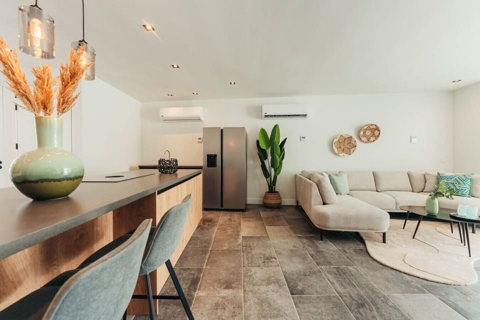 Breakfast bar vibes or cozy couch hangs? This space has got you covered!