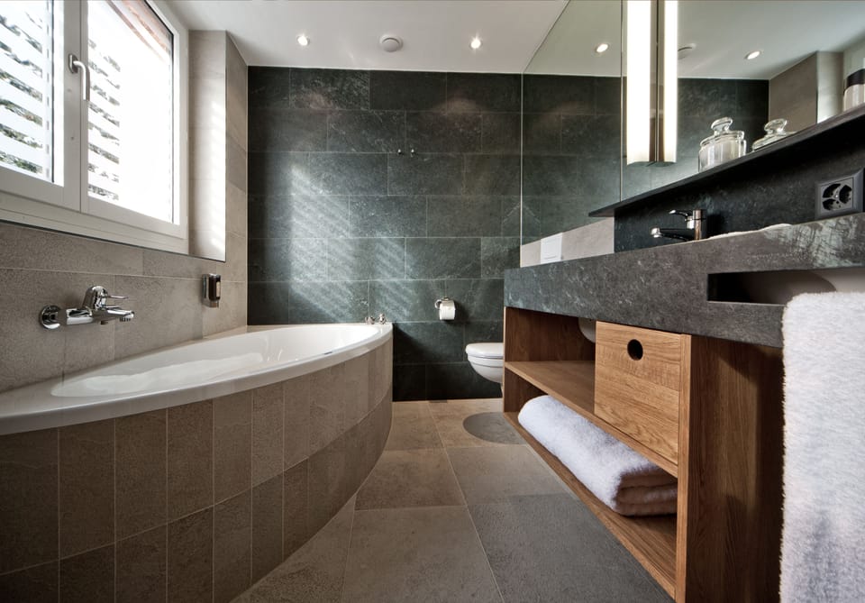 Suite | Bathroom | Hair dryer, bathrobes, slippers, towels
