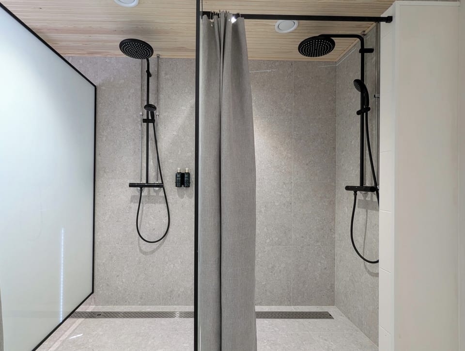 Shower, rainfall showerhead, hair dryer, towels